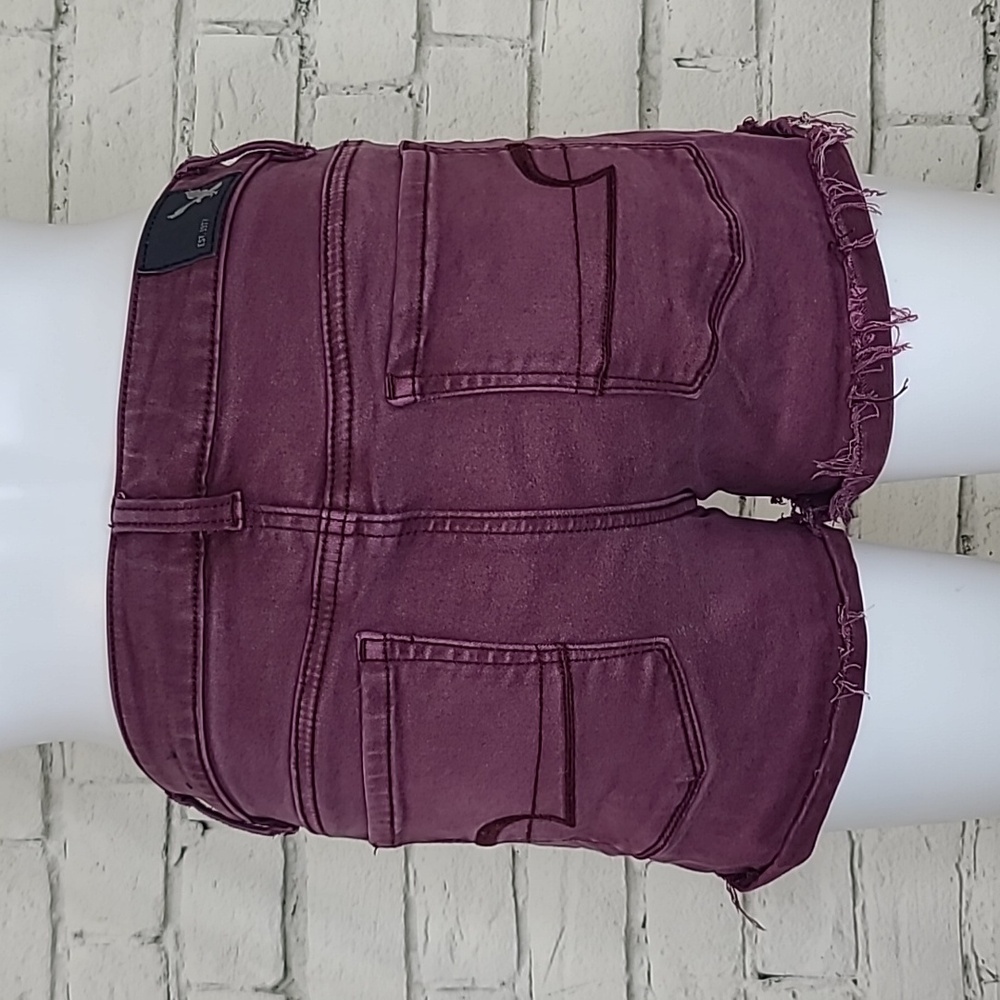 AE Next Level Low Rise Cuffed Raw Hem Cotton Denim Shortie Shorts in Burgundy - Picture 4 of 17